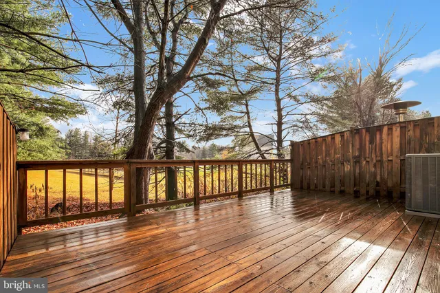 a view of wooden floor with a bench