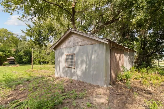 a backyard of a house with lots of green space