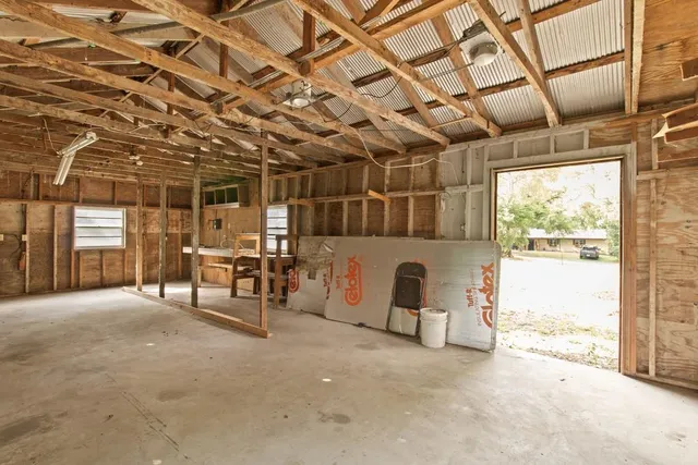 a view of a room with wooden walls