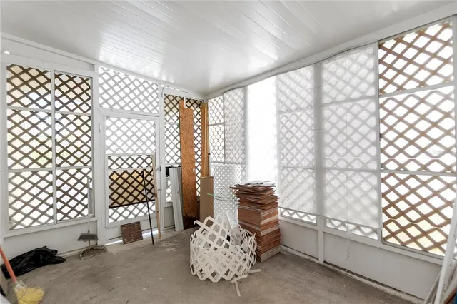a backyard of a house with potted plants