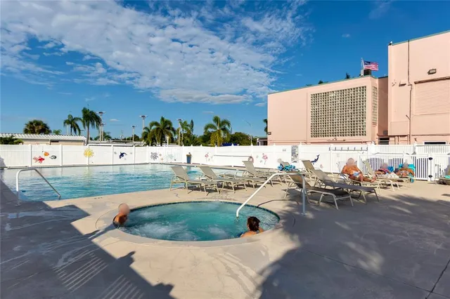 a view of a swimming pool with a yard