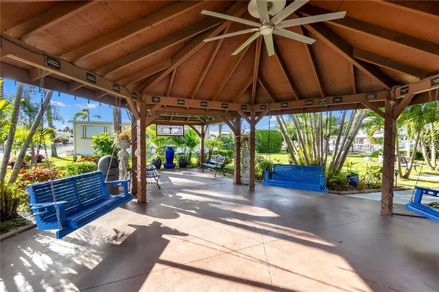 a view of a chairs and table in the patio