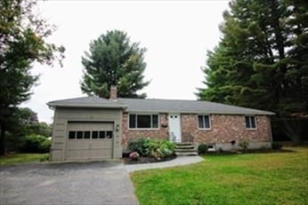 2 McAdams Road Framingham, MA 01701 - Photo 1 of 17 a front view of a house with a garden