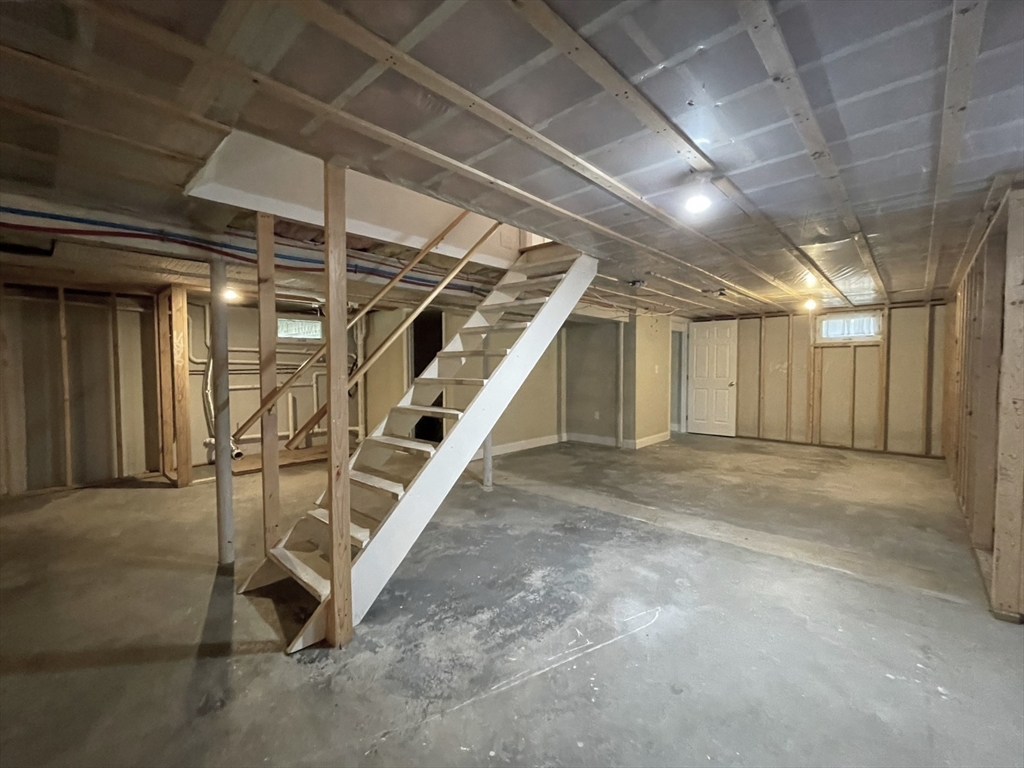 2 McAdams Road Framingham, MA 01701 - Photo 14 of 17 a view of an empty room with stairs
