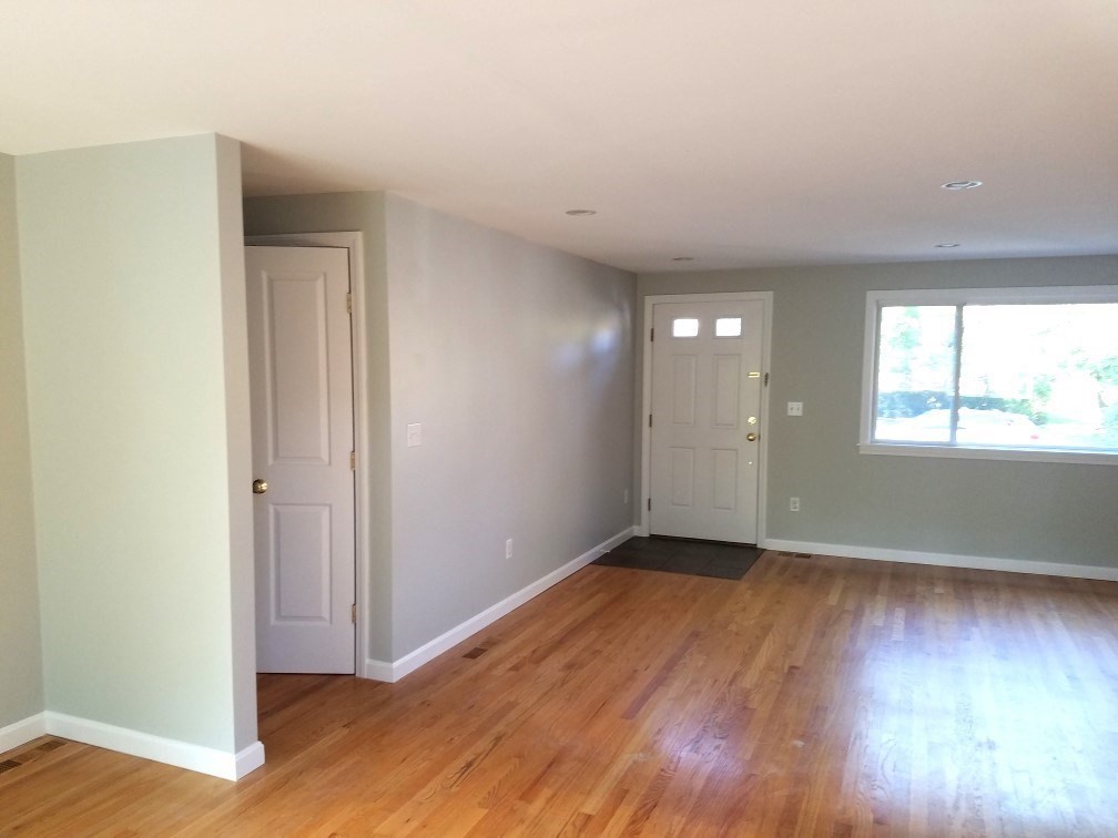 2 McAdams Road Framingham, MA 01701 - Photo 5 of 17 an empty room with wooden floor and windows