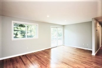 2 McAdams Road Framingham, MA 01701 - Photo 7 of 17 an empty room with wooden floor and windows