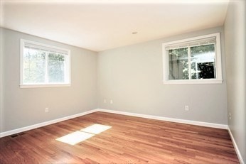 2 McAdams Road Framingham, MA 01701 - Photo 8 of 17 a view of a room with wooden floor and windows
