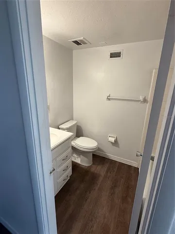 a bathroom with a toilet and a sink