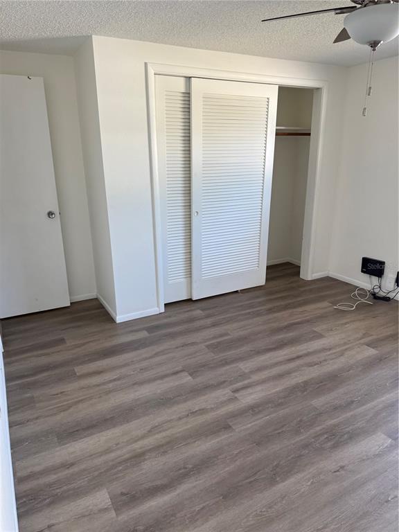 5320 South Lockwood Ridge Road Sarasota, FL 34231 - Photo 22 of 29 a view of an empty room with wooden floor and a window