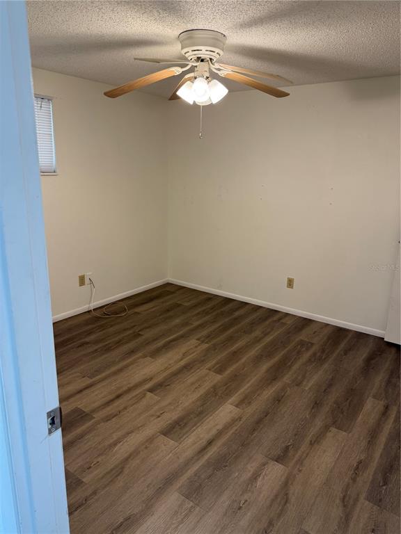 5320 South Lockwood Ridge Road Sarasota, FL 34231 - Photo 26 of 29 a view of a room with an empty space and a ceiling fan