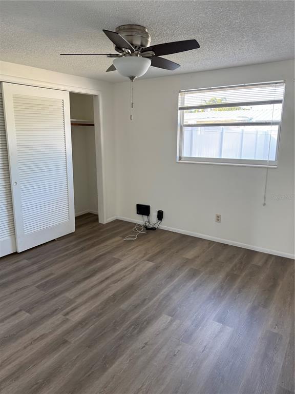5320 South Lockwood Ridge Road Sarasota, FL 34231 - Photo 27 of 29 a view of empty room with wooden floor