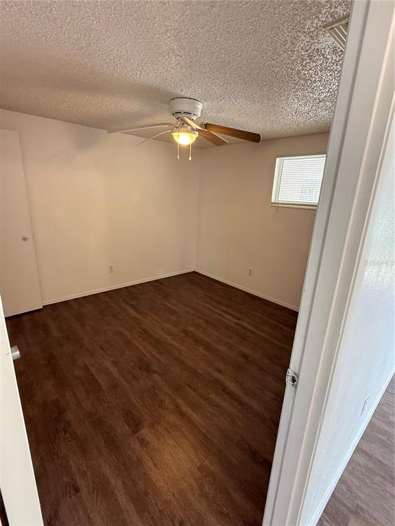 5320 South Lockwood Ridge Road Sarasota, FL 34231 - Photo 9 of 29 en empty room with wooden floor and fan