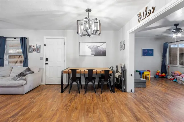 a view of a livingroom with furniture and a window