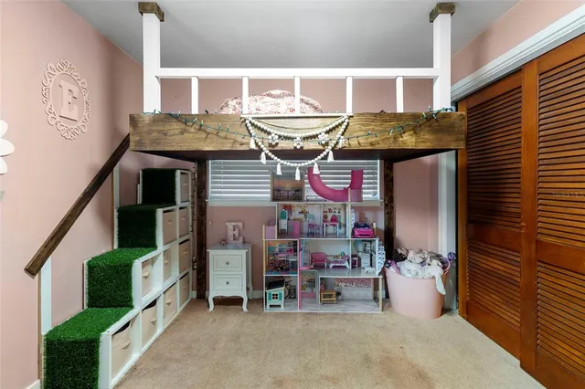 a view of a house with backyard porch and sitting area