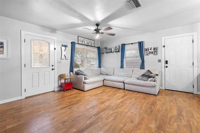 a living room with furniture and a large window
