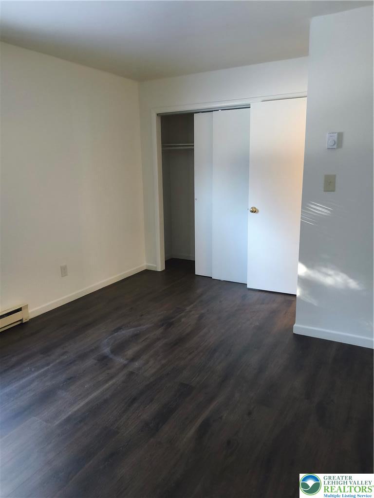 802 West Berwick Street Easton, PA 18042 - Photo 14 of 54 a view of an empty room with wooden floor and a window