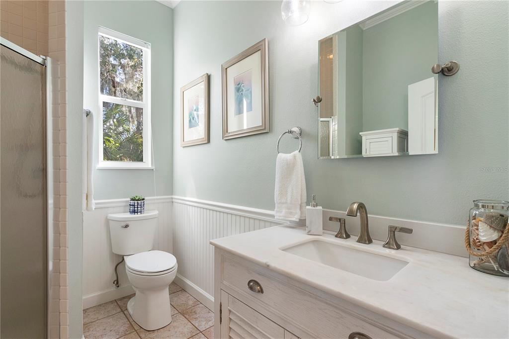 7325 Holly Road Terra Ceia, FL 34250 - Photo 21 of 87 a bathroom with a sink mirror and toilet