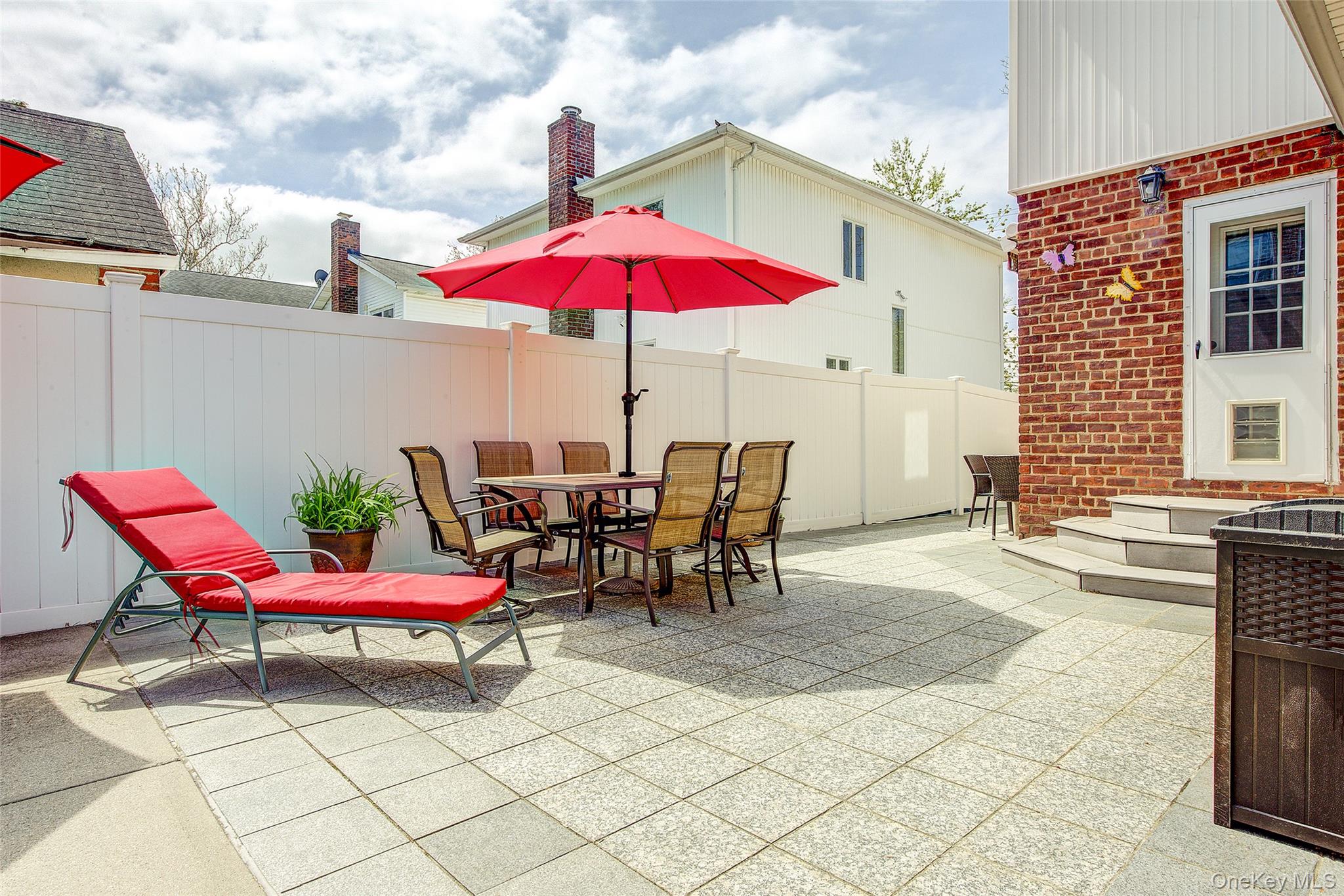 201-04 24th Road Queens, NY 11360 - Photo 45 of 50 Eating / lounging area in the backyard