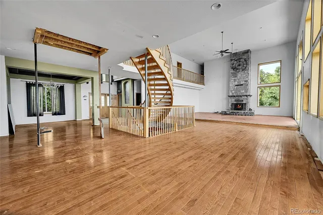 a view of a living room and kitchen with furniture floor to ceiling window