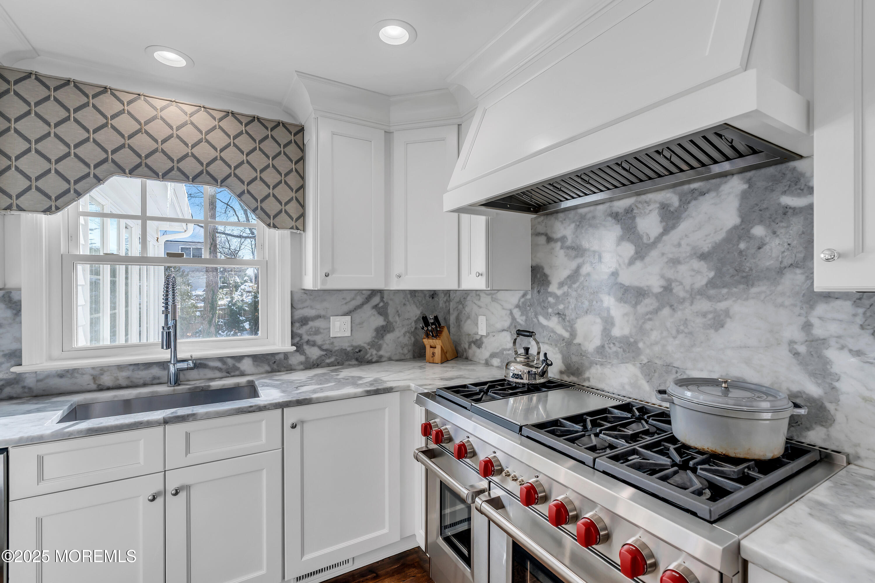91 Lewis Point Road Fair Haven, NJ 07704 - Photo 12 of 58 a kitchen with a stove and a sink