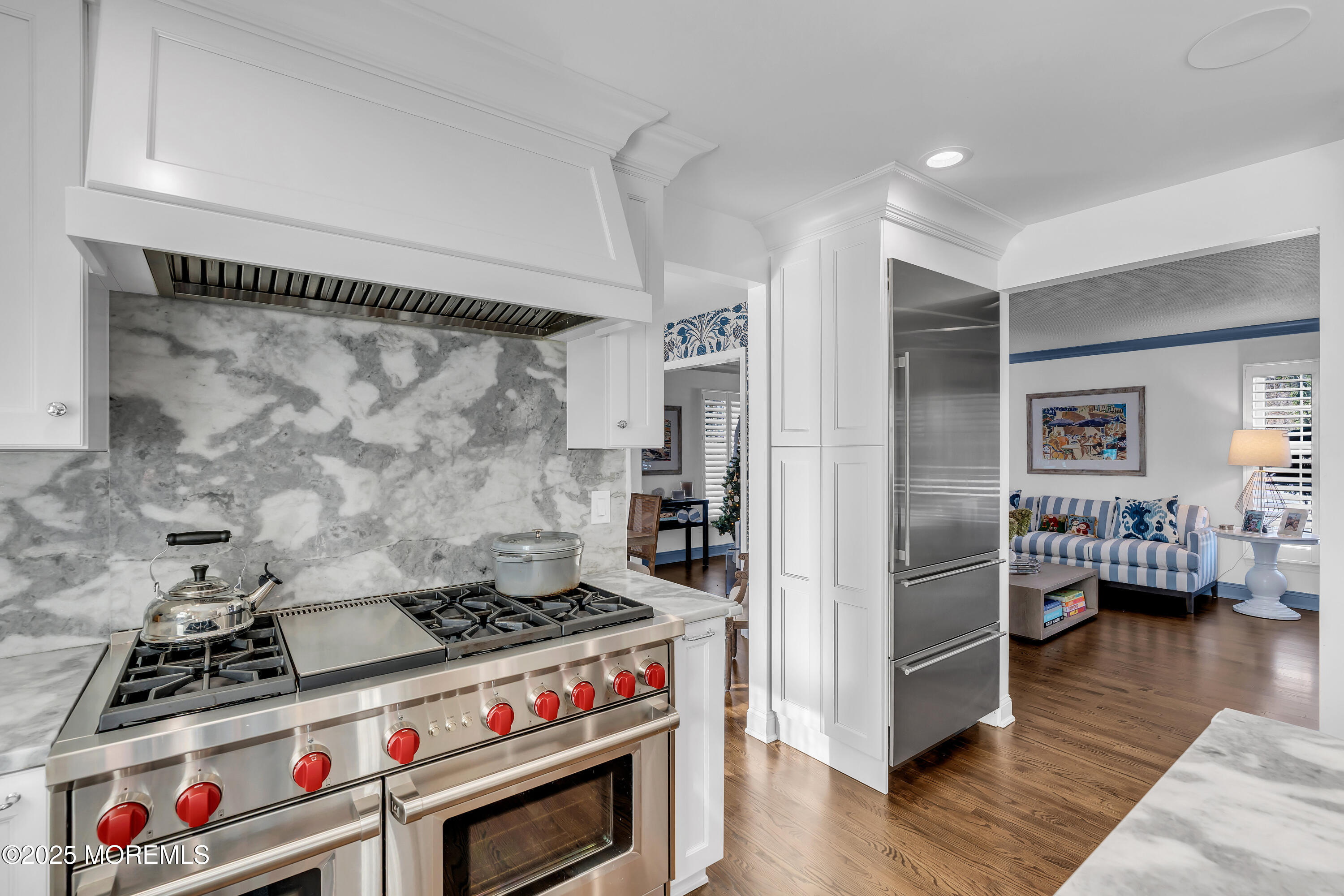 91 Lewis Point Road Fair Haven, NJ 07704 - Photo 13 of 58 a kitchen that has a stove and a wooden floor