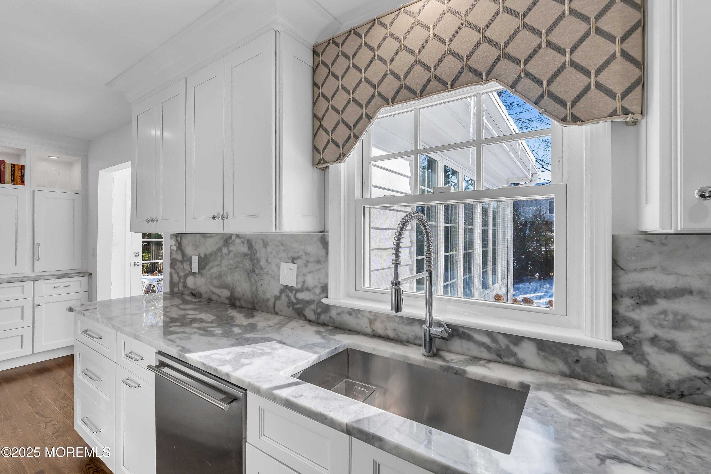 91 Lewis Point Road Fair Haven, NJ 07704 - Photo 14 of 58 a kitchen with a sink and a white cabinets