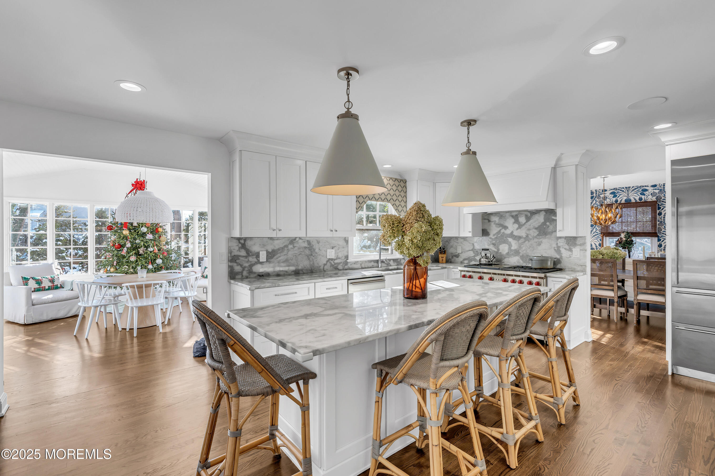 91 Lewis Point Road Fair Haven, NJ 07704 - Photo 15 of 58 a view of a dining room and livingroom with furniture wooden floor a chandelier