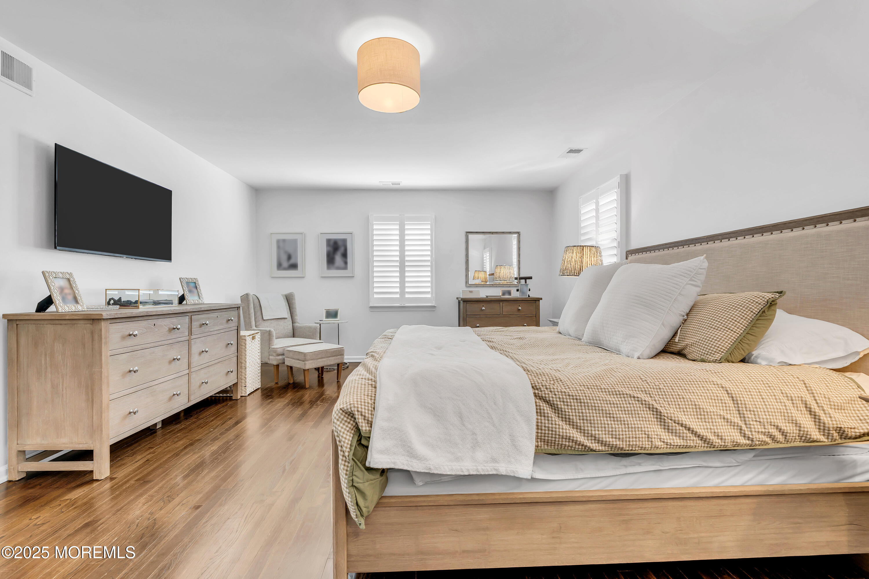 91 Lewis Point Road Fair Haven, NJ 07704 - Photo 28 of 58 a spacious bedroom with a bed and a flat screen tv