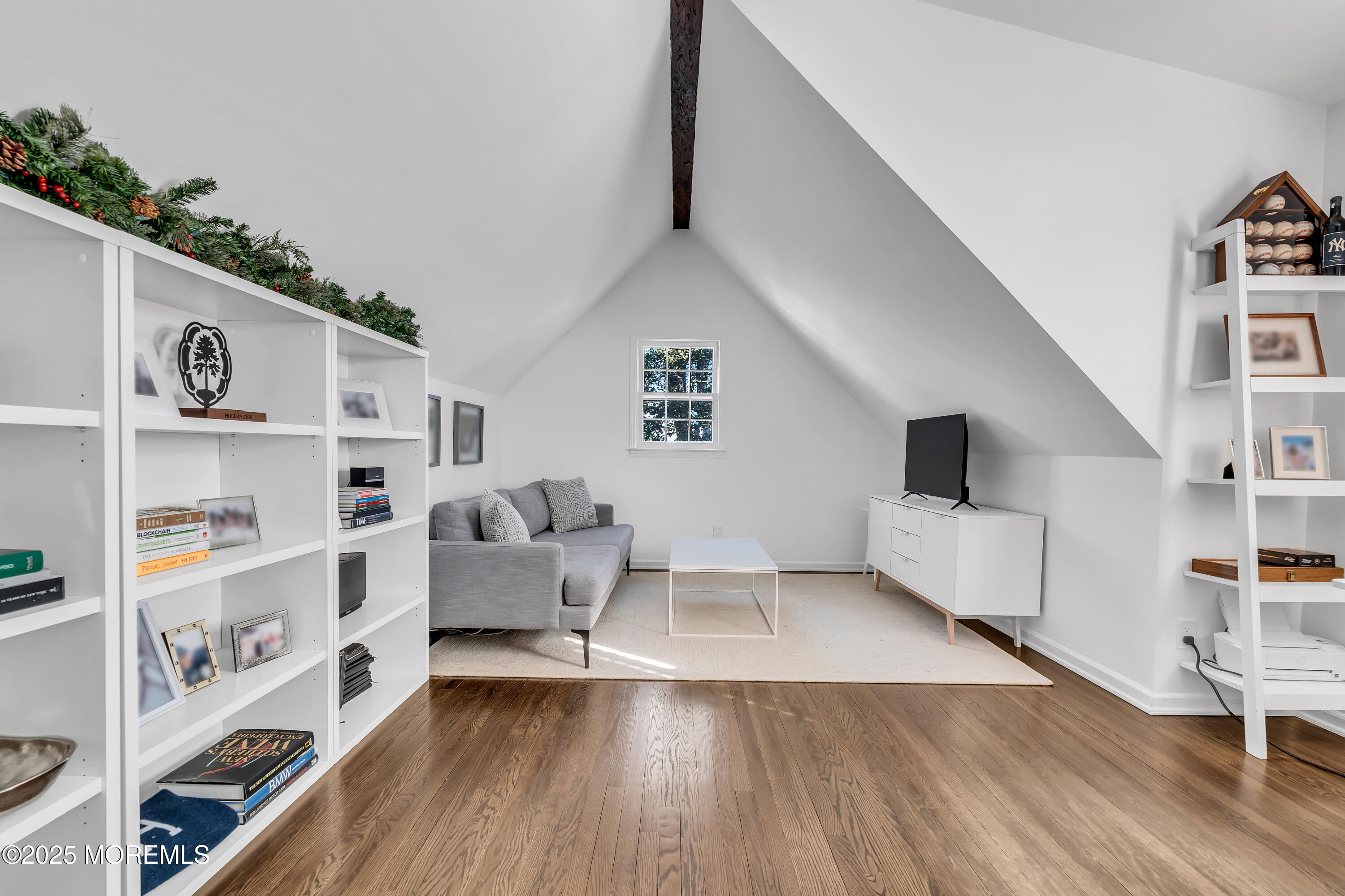 91 Lewis Point Road Fair Haven, NJ 07704 - Photo 34 of 58 a living room with furniture and a book shelf