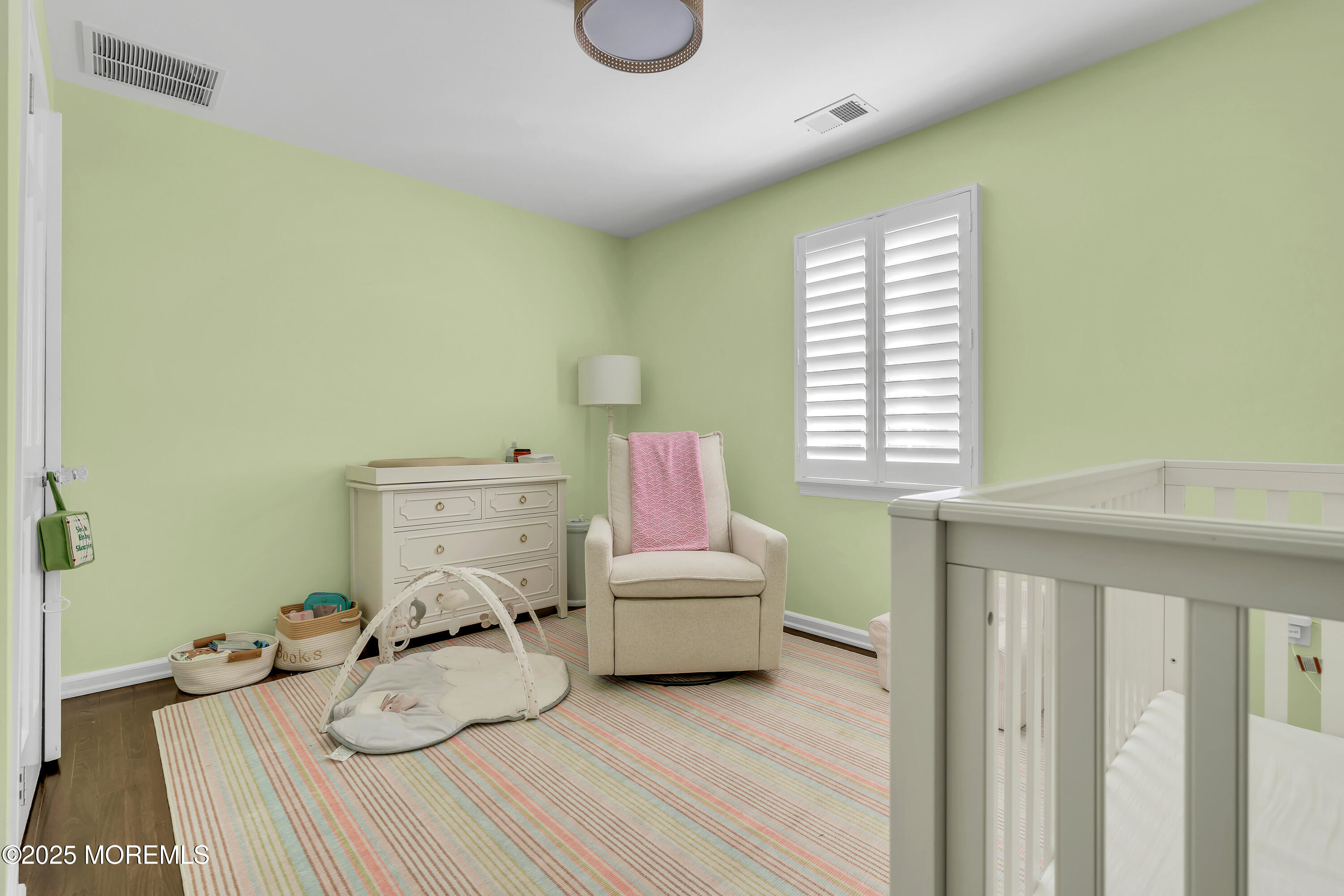 91 Lewis Point Road Fair Haven, NJ 07704 - Photo 39 of 58 a bedroom with a bed and a window