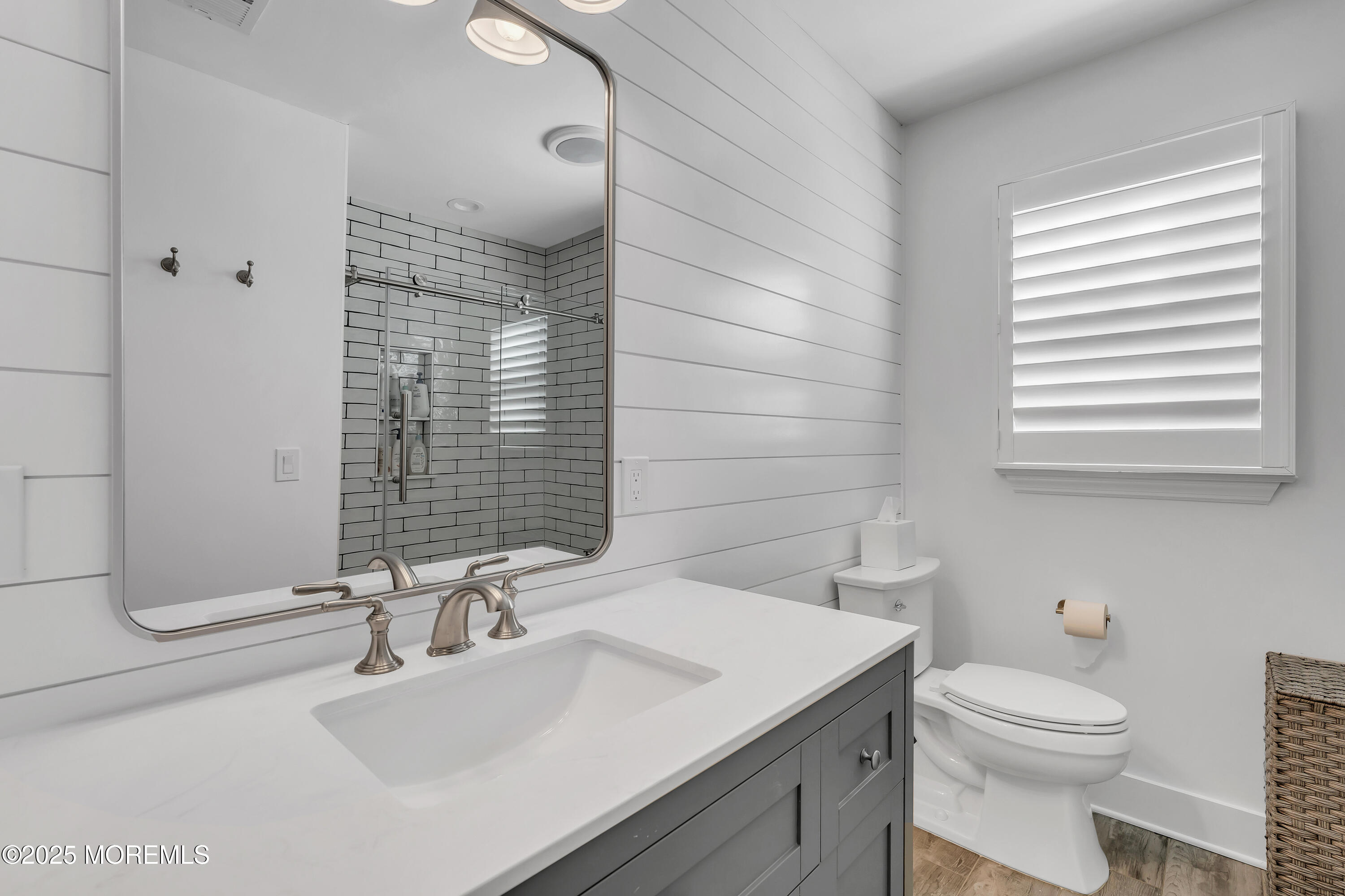 91 Lewis Point Road Fair Haven, NJ 07704 - Photo 40 of 58 a bathroom with a sink a toilet and mirror