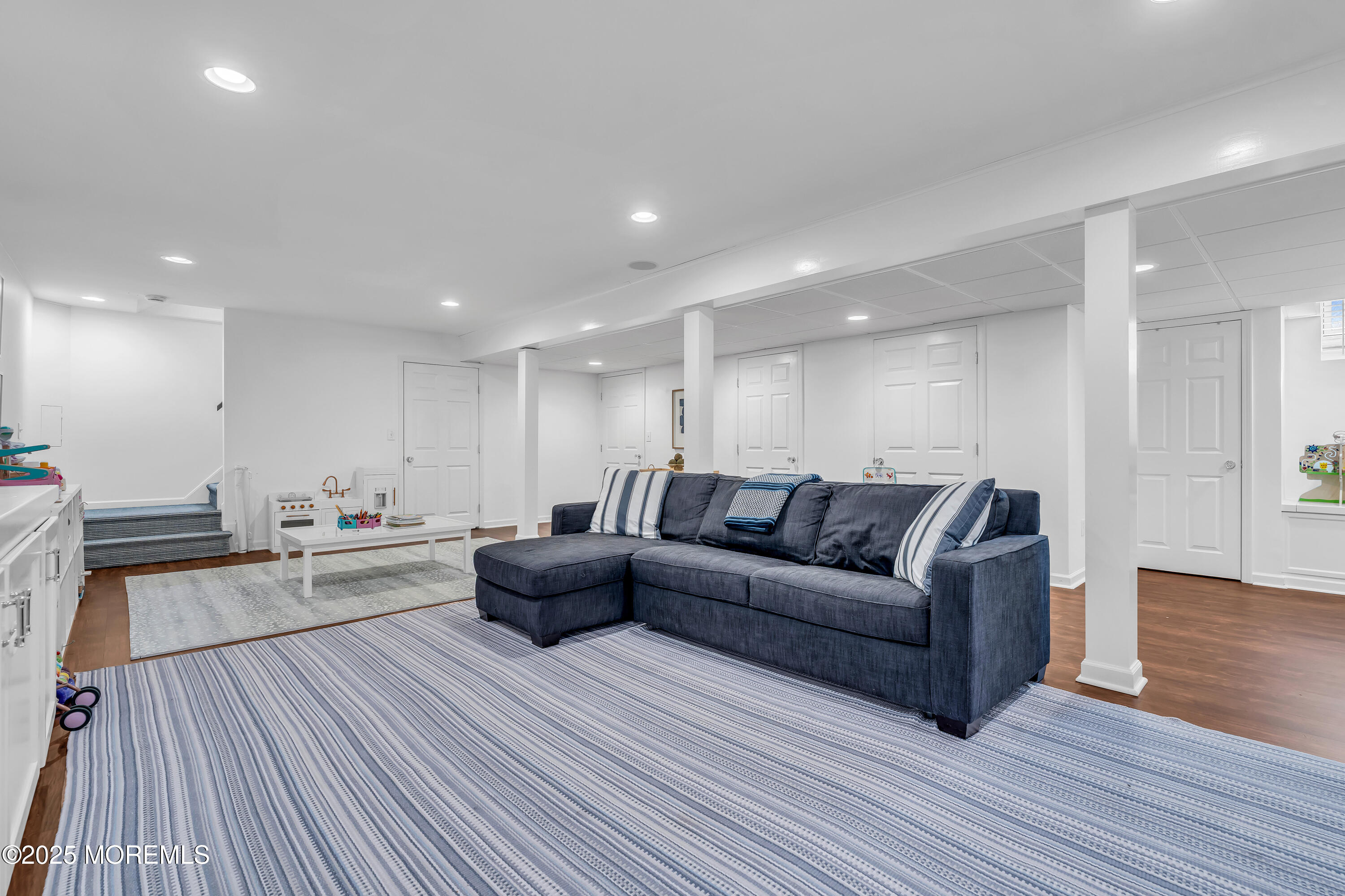 91 Lewis Point Road Fair Haven, NJ 07704 - Photo 43 of 58 a view of a living room a wooden floor and a chandelier