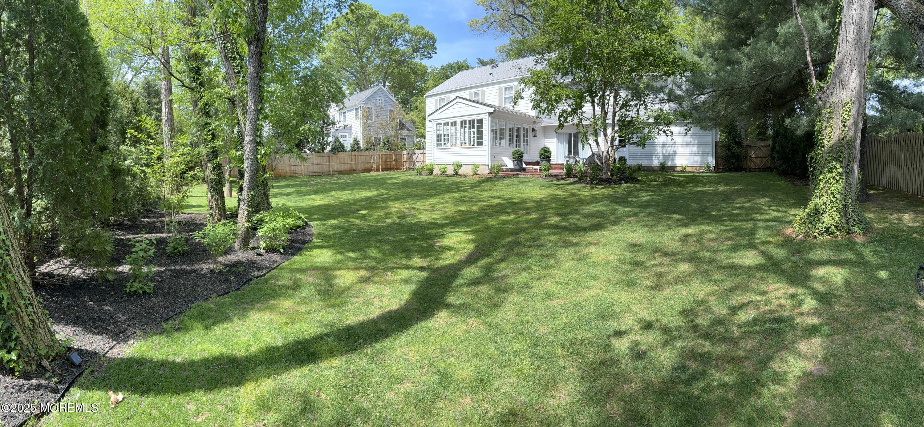 91 Lewis Point Road Fair Haven, NJ 07704 - Photo 47 of 58 a view of a house with a big yard and large trees