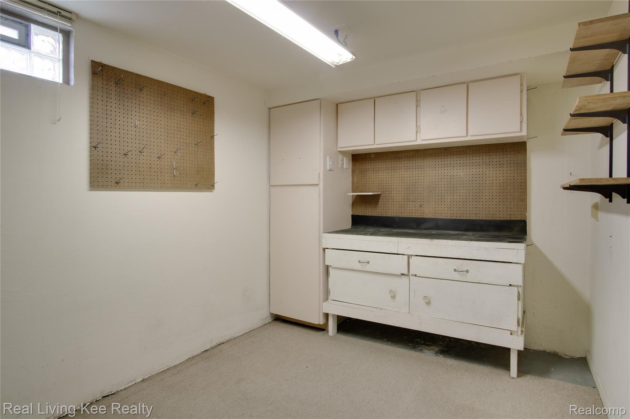 3412 Fairgrove Terrace, Unit 33 Rochester, MI 48309 - Photo 22 of 27 Craft room or work shop in laower level.jpg