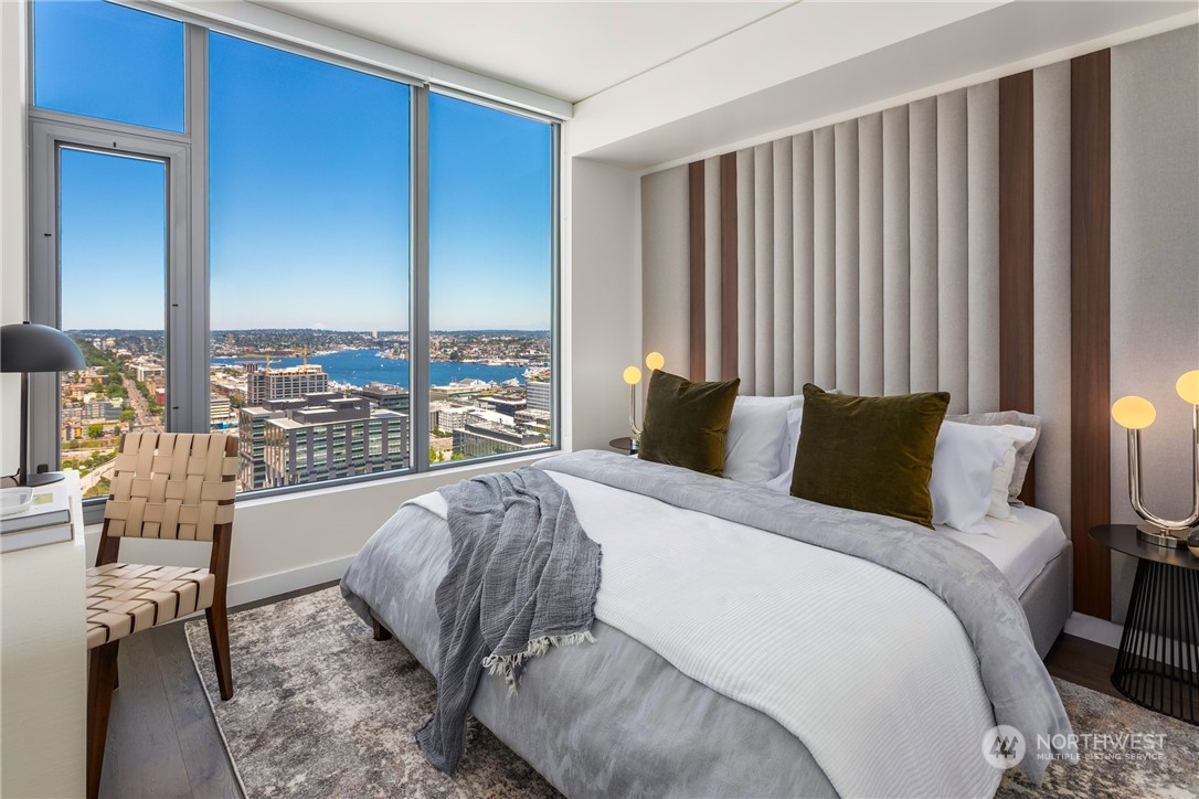 2510 6th Avenue, Unit 2410 Seattle, WA 98121 - Photo 11 of 36 a bed sitting in a bedroom next to a window