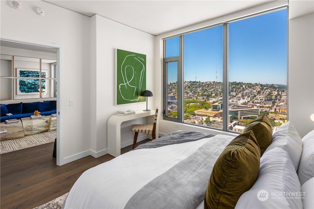 2510 6th Avenue, Unit 2410 Seattle, WA 98121 - Photo 12 of 36 a bedroom with a bed and a large window with outer view