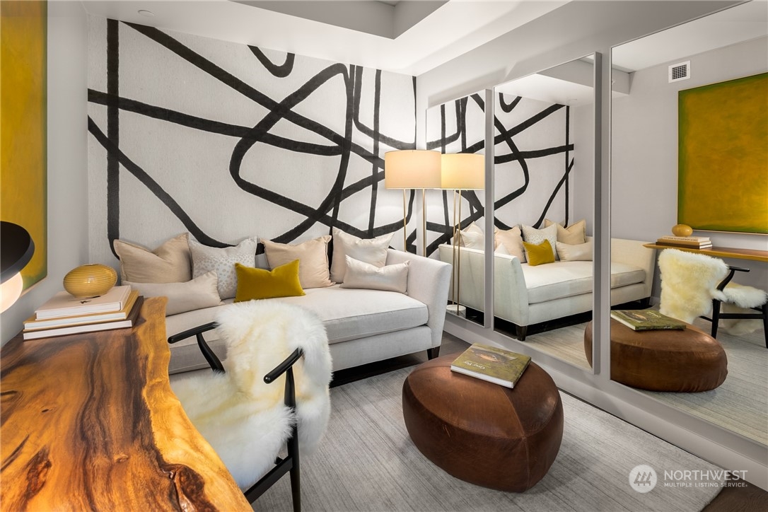 2510 6th Avenue, Unit 2410 Seattle, WA 98121 - Photo 15 of 36 a bedroom with furniture and a couch