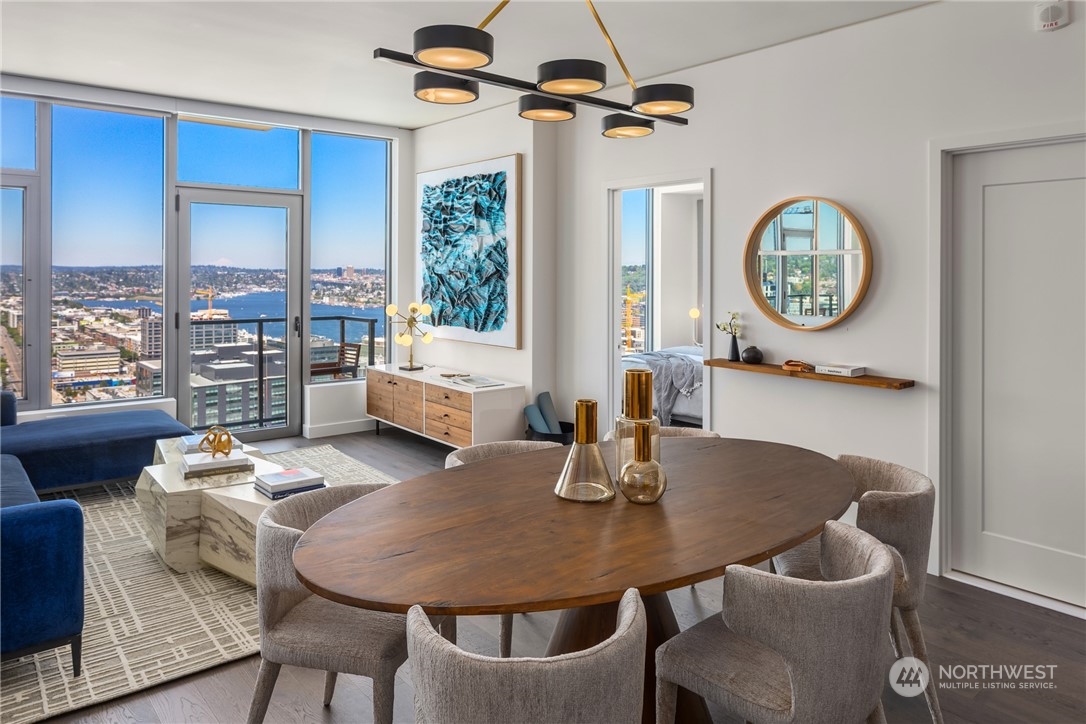 2510 6th Avenue, Unit 2410 Seattle, WA 98121 - Photo 7 of 36 a view of a dining room with furniture window and wooden floor