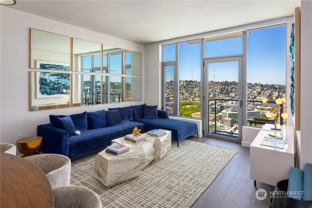 2510 6th Avenue, Unit 2410 Seattle, WA 98121 - Photo 9 of 36 a living room with furniture and a window