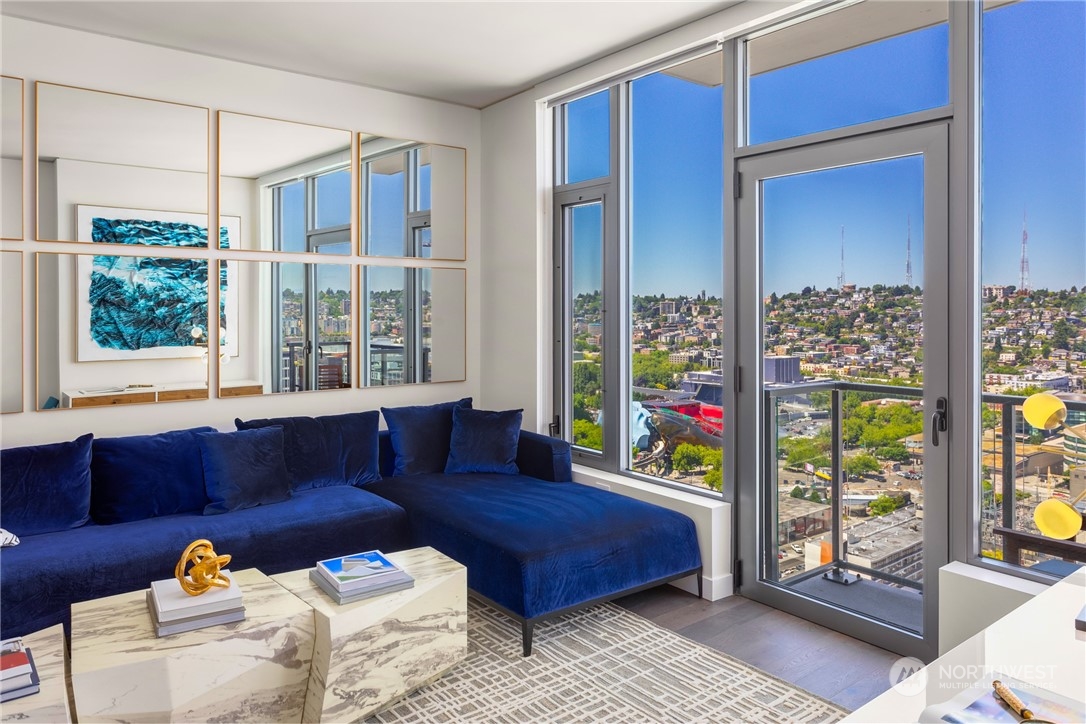 2510 6th Avenue, Unit 2410 Seattle, WA 98121 - Photo 10 of 36 a living room with furniture and a window