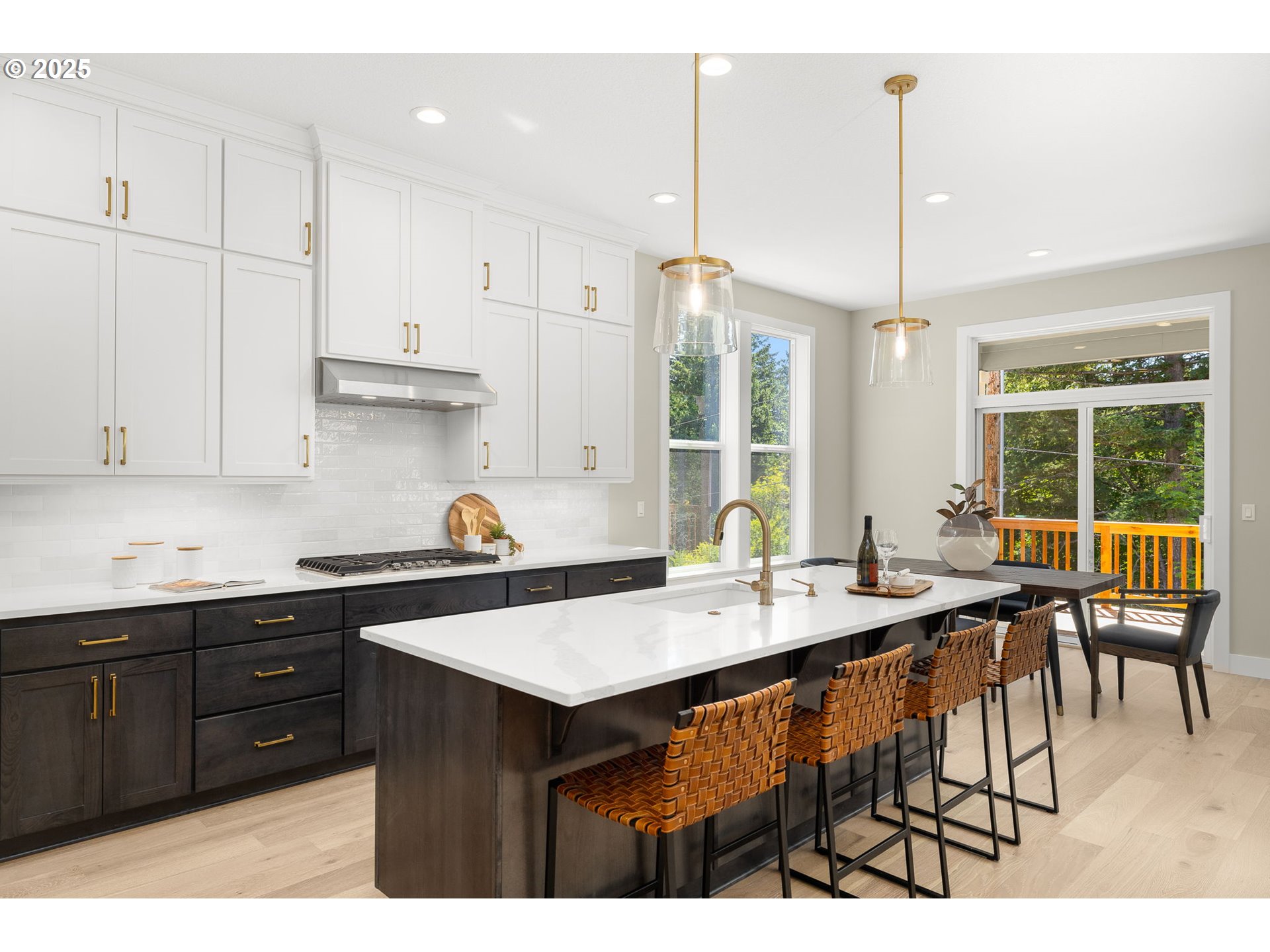 17839 Northwest Layla Drive, Unit LOT 12 Portland, OR 97229 - Photo 12 of 44 a kitchen with stainless steel appliances kitchen island granite countertop a sink a stove and a wooden floors