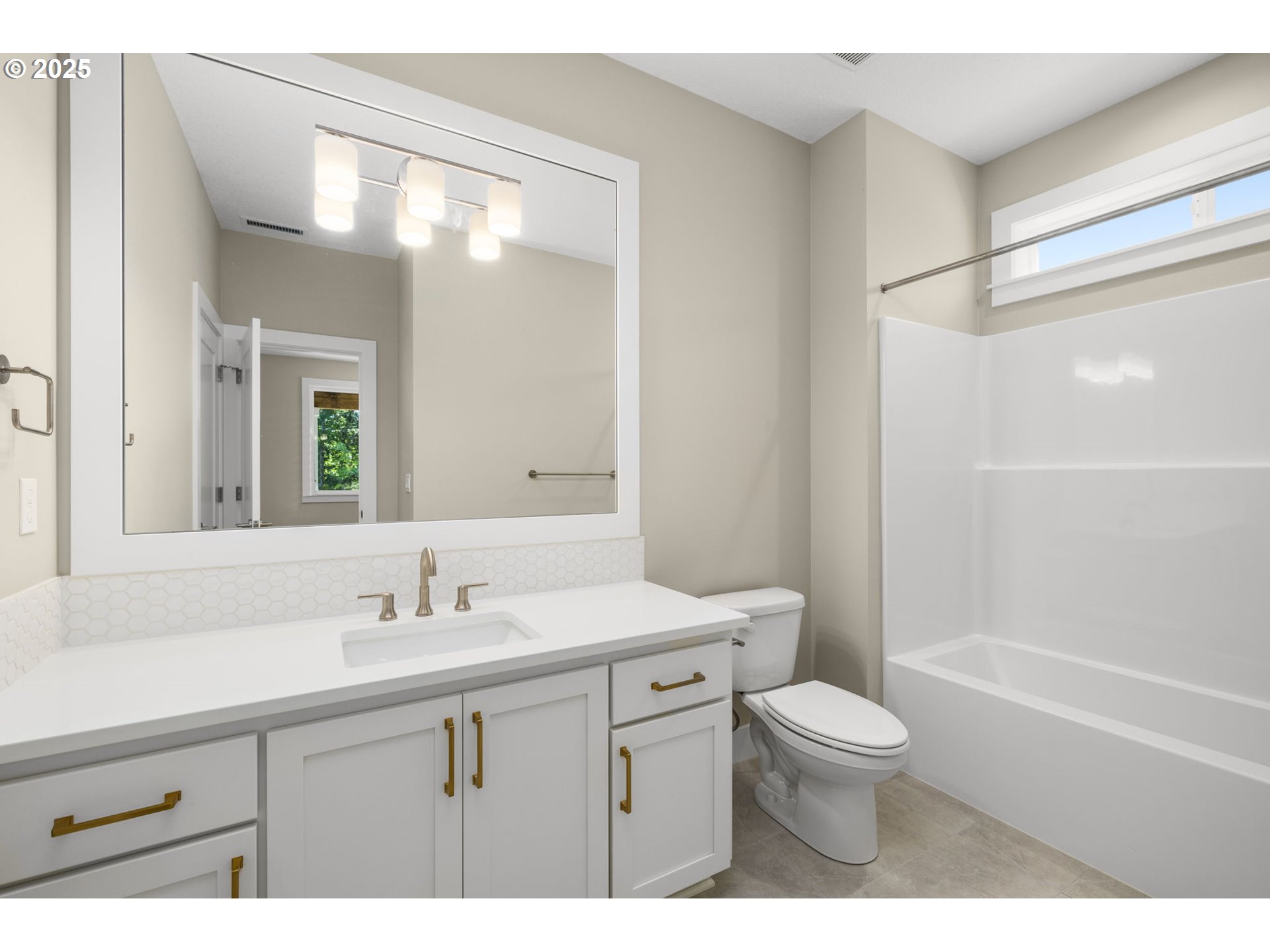 17839 Northwest Layla Drive, Unit LOT 12 Portland, OR 97229 - Photo 17 of 44 a bathroom with a sink a toilet a mirror and shower