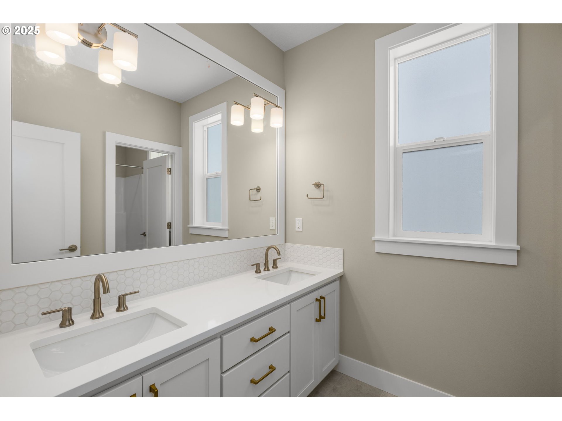 17839 Northwest Layla Drive, Unit LOT 12 Portland, OR 97229 - Photo 30 of 44 a bathroom with a sink and a mirror