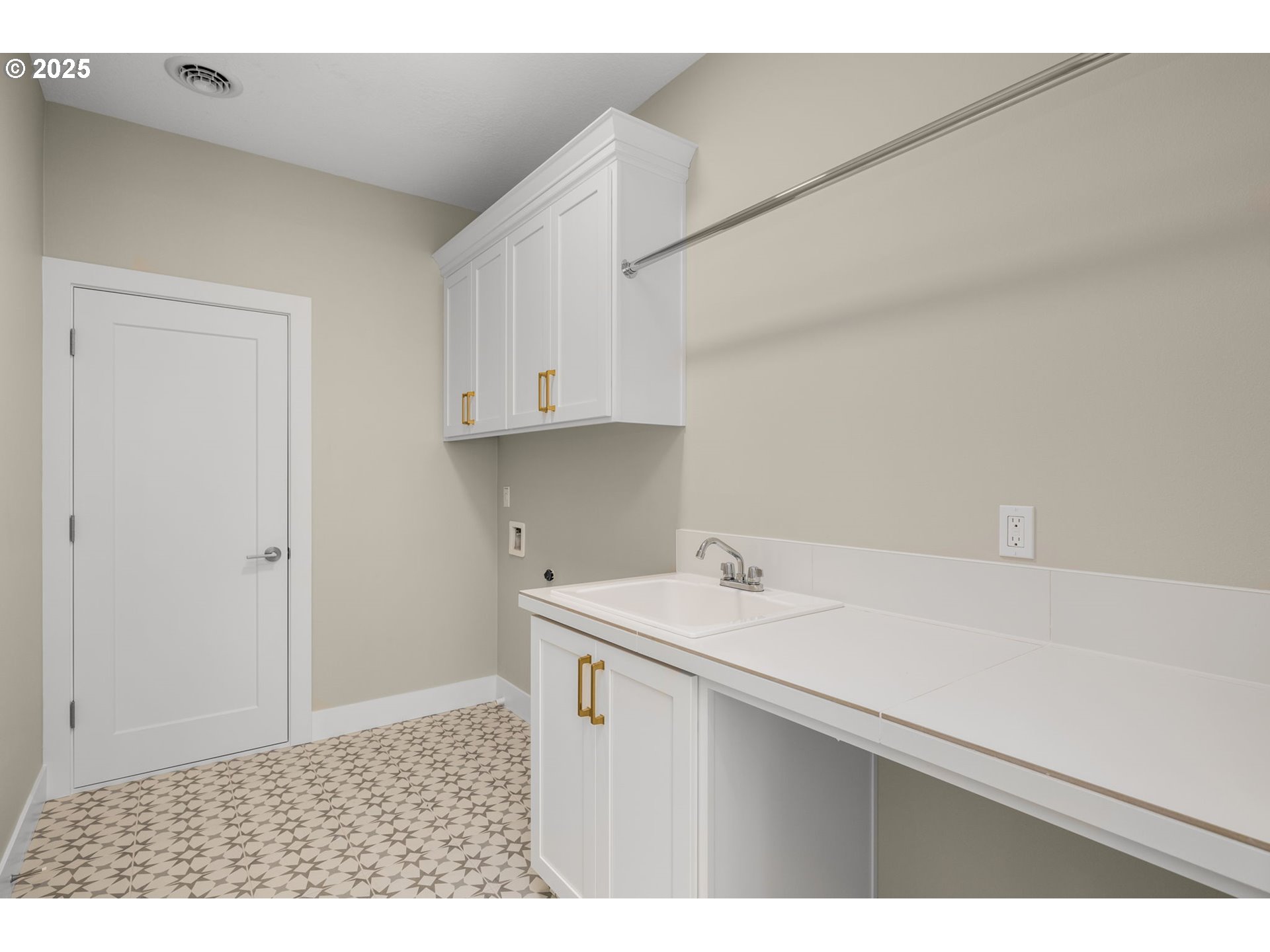 17839 Northwest Layla Drive, Unit LOT 12 Portland, OR 97229 - Photo 34 of 44 a room with a sink cabinets and utility