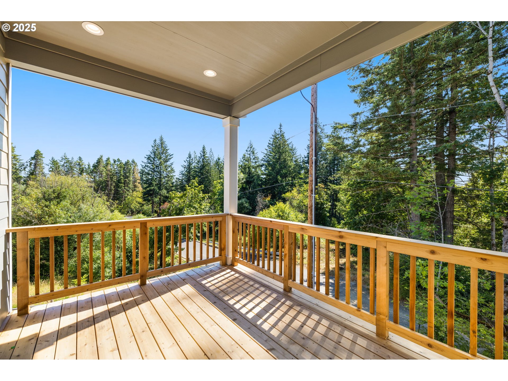 17839 Northwest Layla Drive, Unit LOT 12 Portland, OR 97229 - Photo 35 of 44 a view of balcony with wooden floor and fence