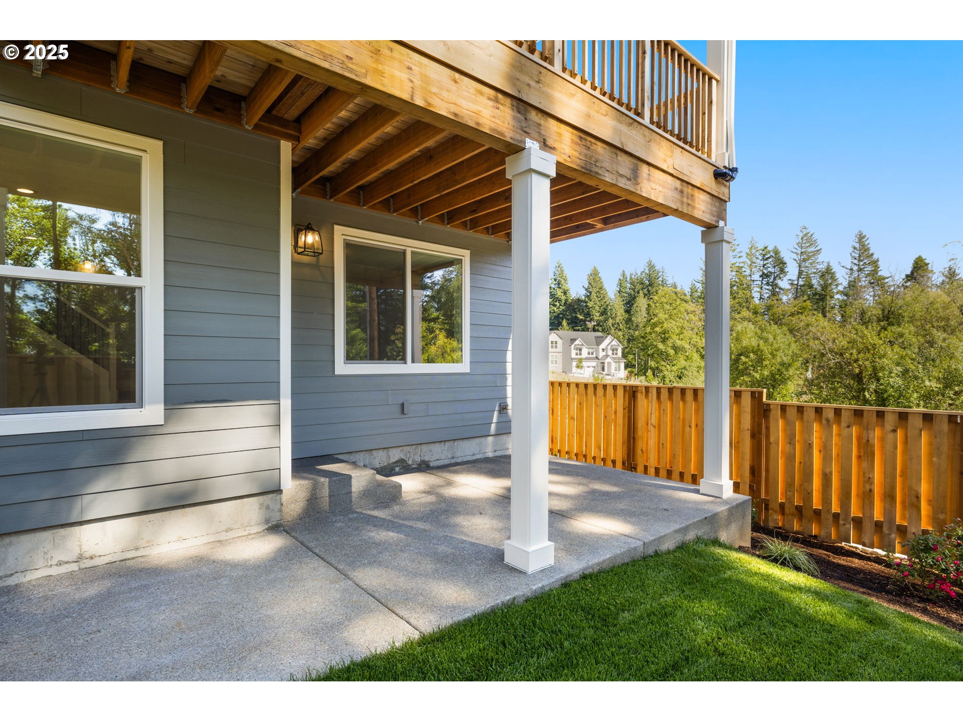 17839 Northwest Layla Drive, Unit LOT 12 Portland, OR 97229 - Photo 38 of 44 a view of a house with backyard and porch