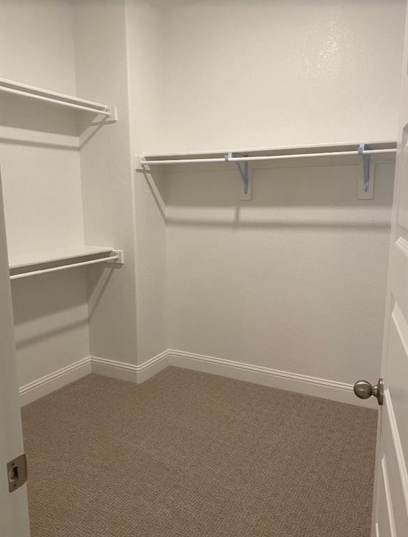 7833 Sunset Boulevard Rowlett, TX 75088 - Photo 12 of 20 a view of an empty walk in closet