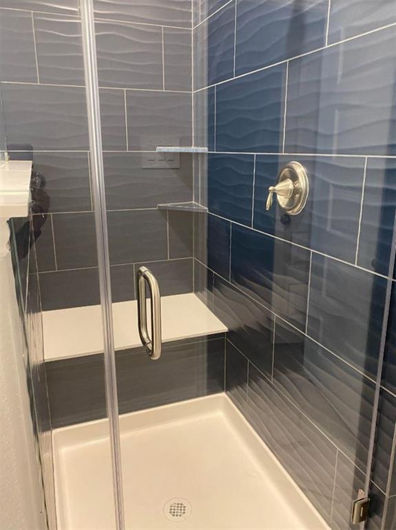 7833 Sunset Boulevard Rowlett, TX 75088 - Photo 13 of 20 a bathroom with a shower