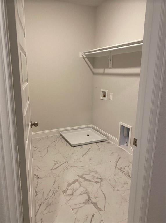 7833 Sunset Boulevard Rowlett, TX 75088 - Photo 18 of 20 a view of a room with racks on the wall