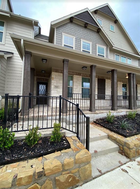 7833 Sunset Boulevard Rowlett, TX 75088 - Photo 2 of 20 a view of a brick house with plants and large windows